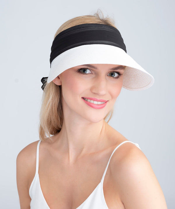 Straw roll-up visor with chiffon trim, adjustable Velcro fastening, flexible fit and packable design for travel, beach and summer sun protection.