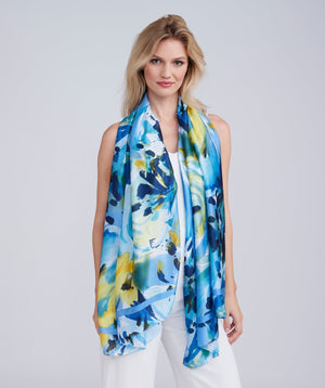Blue oblong scarf featuring a vibrant abstract floral print for a bold patterned finish. Made from silky, lightweight fabric with a finished hem for a clean, structured look and versatile styling.