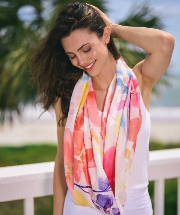 Lemon chiffon multicoloured oblong summer scarf featuring an oversized floral print in vibrant tones for a bold patterned finish. Made from soft, lightweight fabric with an easy wrap and drape shape for versatile styling.