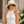 Natural straw fedora hat with floral ribbon trim, adjustable fit and UPF 50+ sun protection for beach, holiday and summer resort wear.